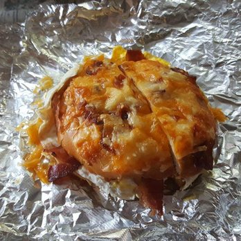 Manhattan Bagel - bacon egg and cheese on a roll with melted egg bacon and cheese on top - Bagels Near Me - Summit, New Jersey Manhattan Bagel - bacon egg and cheese on a roll with melted egg bacon and cheese on top - Bagels Near Me - Summit, New Jersey