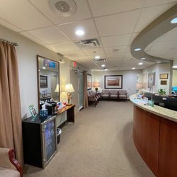 Memorial City Smiles - Front desk and waiting room with water and coffee