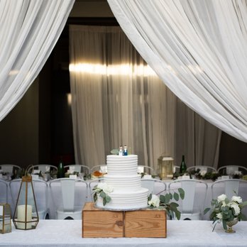 Aracely Cafe - Cake table and long dinner tables. Photo by Wolf Weddings Photography. - New American Near Me - San Francisco, California
