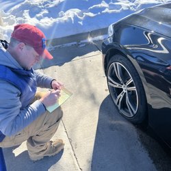 Manager Josh, noting damage due to car wash track.