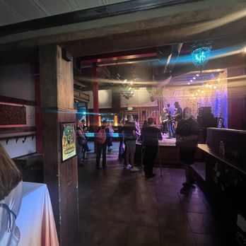Saint Rocke - a group of people in a restaurant - Music Venues Near Me - Hermosa Beach, California