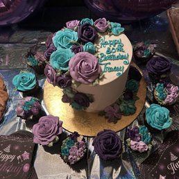 Aqua blue and purple floral birthday cake. 9" 3 layers. With a dozen matching cupcakes.