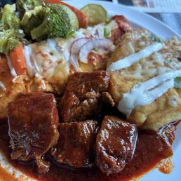 Chicken enchilada, Chile roja, and Chile relleno. Just plate of the day lol.
