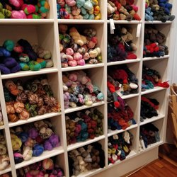 Looped Yarn Works - One of the many walls of yarn.