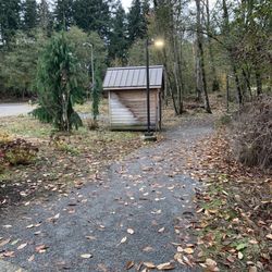Outhouse by the parking lot.