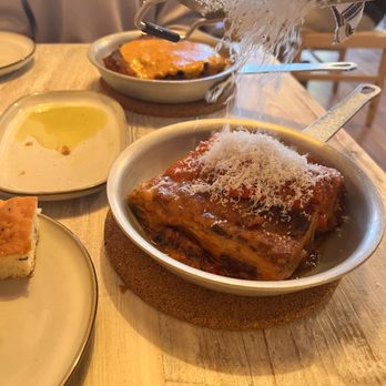 Capri Lasagneria - Italian Sausage Lasagna (front. midst cheese), Pollo Alla Vodka (back, un-cheesed yet) - Italian Near Me - Burlingame, California Capri Lasagneria - Italian Sausage Lasagna (front. midst cheese), Pollo Alla Vodka (back, un-cheesed yet) - Italian Near Me - Burlingame, California