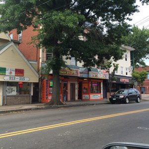 Photo of Panaderia La Tapatia - New Haven, CT, United States. Colorful orange facade hints at delightful treasures inside.