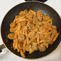 Trader Joe's - Penne all'Arrabbiata with spicy Italian chicken sausage and quattro formaggio cheese blend. It's what's for supper.