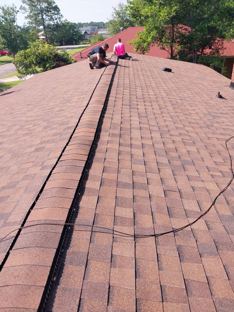 Slide of Tyndal Roofing