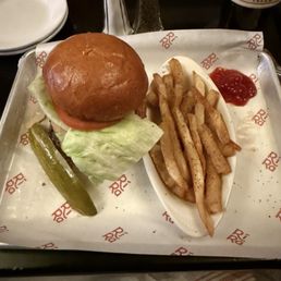 Guinea's BBQ Sauce Pub Burger. It doesn't look like much but it was tasty. Guinea's BBQ Sauce Pub Burger. It doesn't look like much but it was tasty.