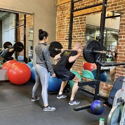 Fit Evolution Gym - Piedmont Ave. - Squat assistance