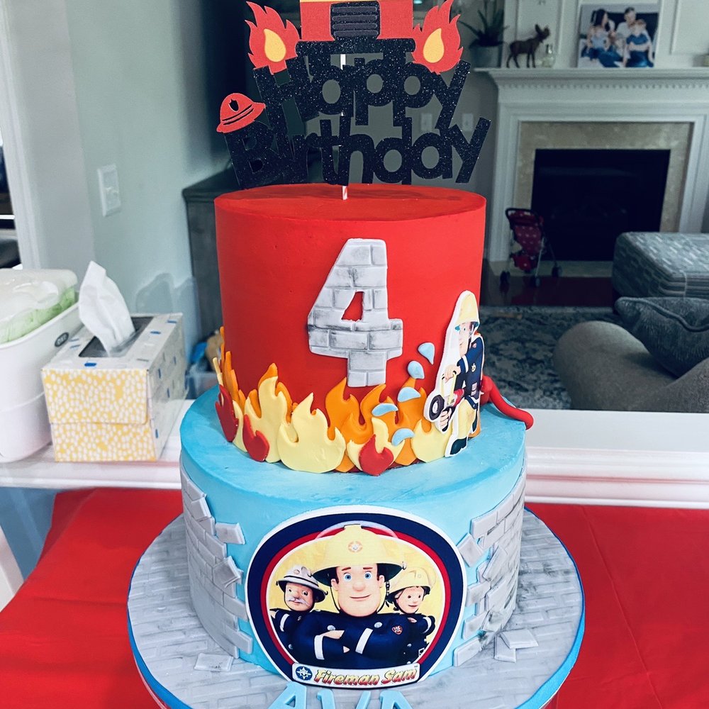 Fireman Sam theme. Top tier vanilla with vanilla buttercream and bottom was strawberry with vanilla buttercream...delicious Fireman Sam theme. Top tier vanilla with vanilla buttercream and bottom was strawberry with vanilla buttercream...delicious