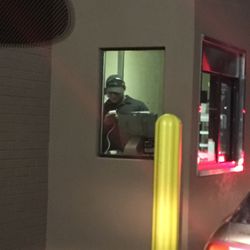 Wendy's - This is why the drive thru is so long, cashier to busy on his personal phone. Not to mention the many germs on his phone being passed out