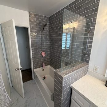 MGMP Construction Group - Bathtub installed and new tile - General Contractors Near Me