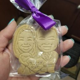 a hand holding a cookie