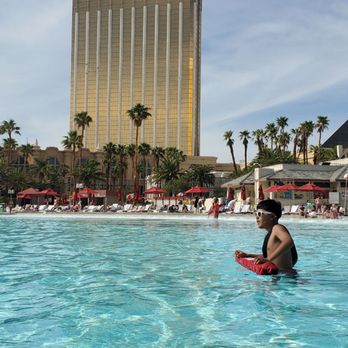 Mandalay Bay Beach - In the Wave Pool with a view of the W Las Vegas - Swimming Pools Near Me - Las Vegas, Nevada Mandalay Bay Beach - In the Wave Pool with a view of the W Las Vegas - Swimming Pools Near Me - Las Vegas, Nevada
