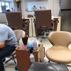 Fantasy Nail Salon - Small cart shared by two workers.