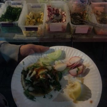 Taco Stand - a person holding a plate of food - Food Trucks Near Me - Los Angeles, California Taco Stand - a person holding a plate of food - Food Trucks Near Me - Los Angeles, California