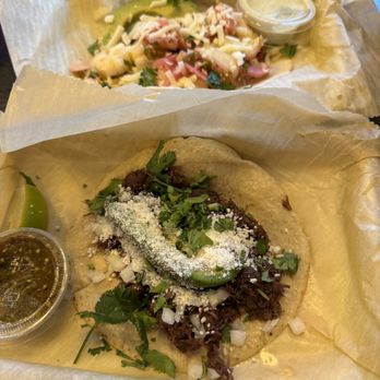 Torchy's Tacos - Democrat Taco (front) and December special (back) - Tacos Near Me - Columbus, Ohio Torchy's Tacos - Democrat Taco (front) and December special (back) - Tacos Near Me - Columbus, Ohio
