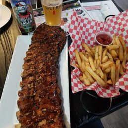 Full rack of ribs, fries, Rudi's Lager.