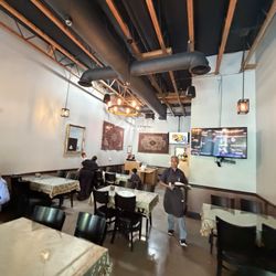 Miras Grill - Interior and the owner.