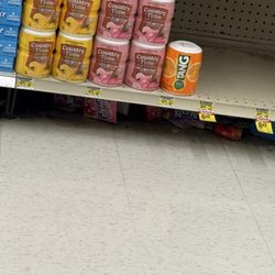 Jewel-Osco - Garbage and product under shelves!!