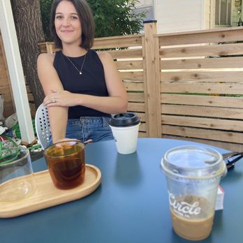 Circle Coffee - Outdoor seating area, an Honduran pour over, an Americano to go, and an iced latte. - Coffee & Tea Near Me - Topeka, Kansas