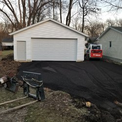 Plaso Construction - 24x26, wrapped, sided, shingled, 16x8 insulated door, w/ man door.