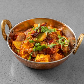 Red Onion - A semi-dry and colorful preparation of homemade cottage cheese cooked in a wok with bell peppers, onions and tomatoes. - Vegetarian Near Me - New York, New York Red Onion - A semi-dry and colorful preparation of homemade cottage cheese cooked in a wok with bell peppers, onions and tomatoes. - Vegetarian Near Me - New York, New York
