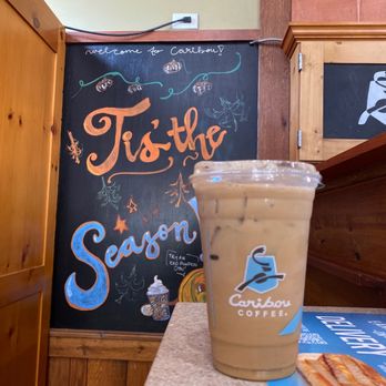 Caribou Coffee - a cup of coffee on a counter - Coffee & Tea Near Me - Atlanta, Georgia Caribou Coffee - a cup of coffee on a counter - Coffee & Tea Near Me - Atlanta, Georgia