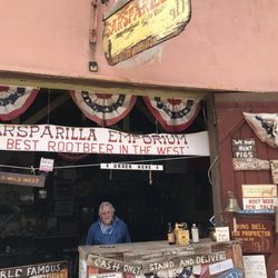 Tombstone Sarsparilla - Johnny One Dog ($10 for a collector 4-pack or a case of 24 for $40) - Tombstone bottled water is $2. Cold ones available.