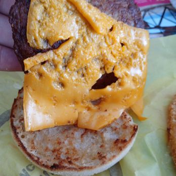 McDonald's - a hand holding a cheeseburger - Fast Food Near Me - Lake Charles, Louisiana McDonald's - a hand holding a cheeseburger - Fast Food Near Me - Lake Charles, Louisiana