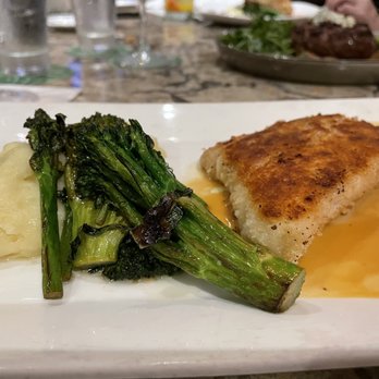 Tommy Bahama - Fresh catch special: Macadamia Nut crusted mahi-mahi. I sub rice for potatoes and asparagus for Roasted Broccolini YUM - Seafood Near Me - Kihei, Hawaii