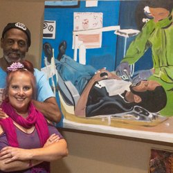The Fox Gallery - Owner and Artist featured next to one of his paintings