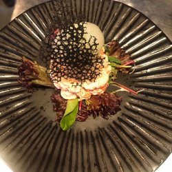 Crayfish salad, parsley and lime foam, mooli mild winter radish, topped with a squid ink tuille