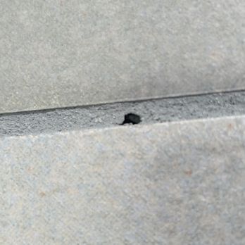 Three Oranges - Various holes throughout the walls where grout was not checked for air pockets - General Contractors Near Me - Orange, New Jersey