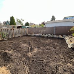 Will And Son's Excavation - after, rock wall and fresh topsoil
