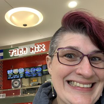 Taco Mix - a smiling woman in a restaurant - Salvadoran Near Me - Tacoma, Washington