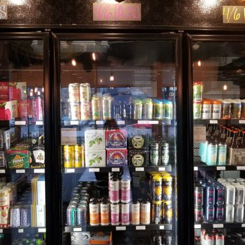 TeKu Tavern + Cafe - One of the many fridges of beer - Beer Bar Near Me - Seattle, Washington