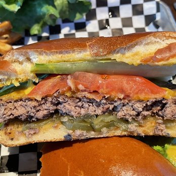 The Bar Olathe - Cutaway of the Smoked cheddar bacon burger - Sports Bars Near Me - Olathe, Kansas The Bar Olathe - Cutaway of the Smoked cheddar bacon burger - Sports Bars Near Me - Olathe, Kansas