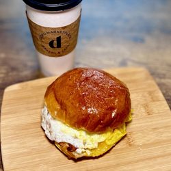 DORO Marketplace - South main breakfast sandwich - bacon, egg, cheddar on a house made brioche roll + large dark roast coffee