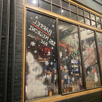 Bully Boy Distillers - Outside looking into the long slim bar and eating pub area nicely decorated for the holidays! - Distilleries Near Me - Roxbury, Massachusetts