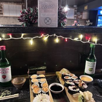 Shokunin - Strawberry and apple soju. Squid and scallop sashimi. Shrimp crunch temaki, spicy salmon, spicy tuna, creamy shrimp temaki - Sushi Bars Near Me - Redlands, California