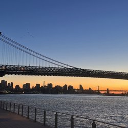 New York Like A Native - Three bridges in Brooklyn, at night, looking south along the East River: Williamsburg Bridge, Manhattan Bridge, and Brooklyn Bridge