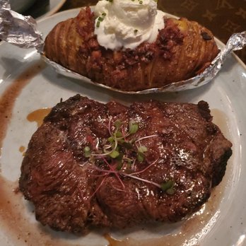 Le Moo - Dry age Ribeye with slice bake potatoe - Steakhouses Near Me - Louisville, Kentucky Le Moo - Dry age Ribeye with slice bake potatoe - Steakhouses Near Me - Louisville, Kentucky