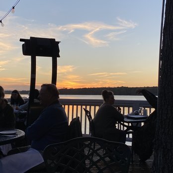 The Boathouse - people sitting at tables on the deck - Seafood Near Me - Midlothian, Virginia