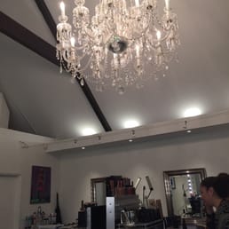 The gorgeous chandelier in the middle of the shop.