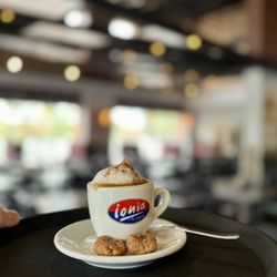 Cotto & Crudo - Enjoy a classic espresso macchiato with our very own cinnamon wine cookie clusters.
