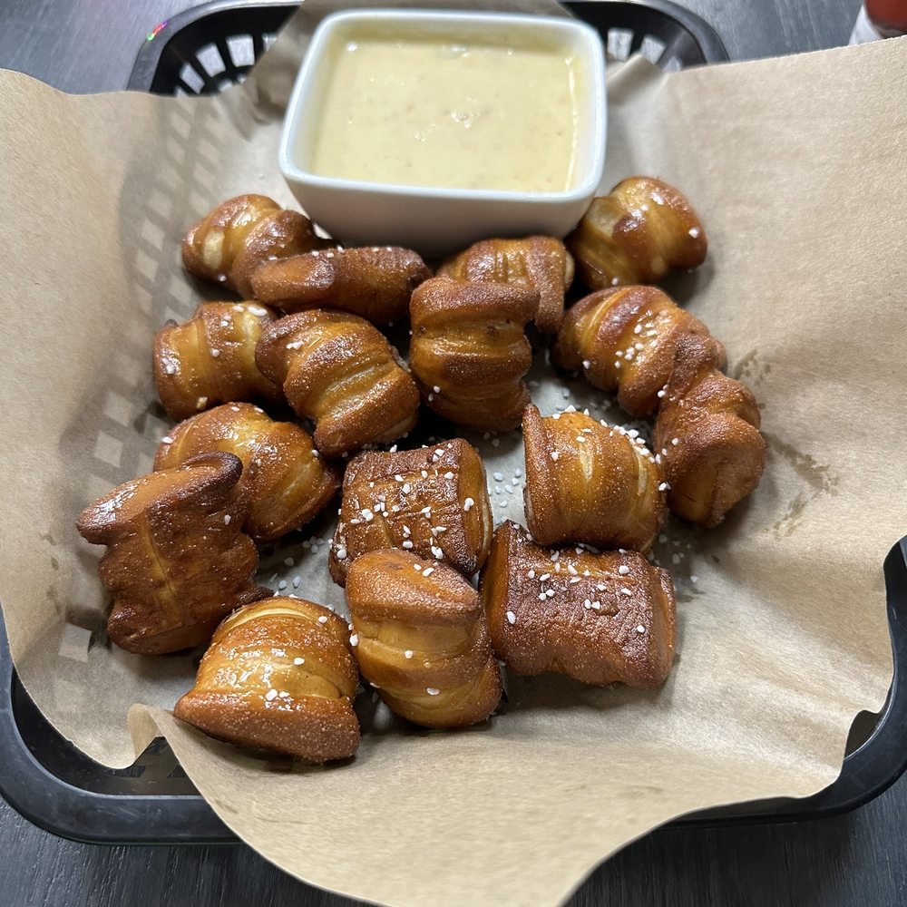 Wild Chicken Grill - Pretzel bites with white queso substituted for beer cheese. - Bars Near Me - Bellevue, Nebraska