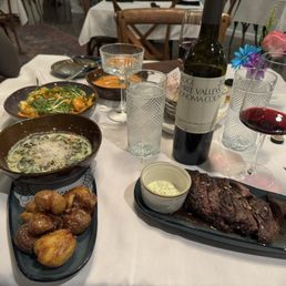 Skirt Steak, crispy potatoes, Curry Shrimp, Tomato Bisque, Creamed Spinach